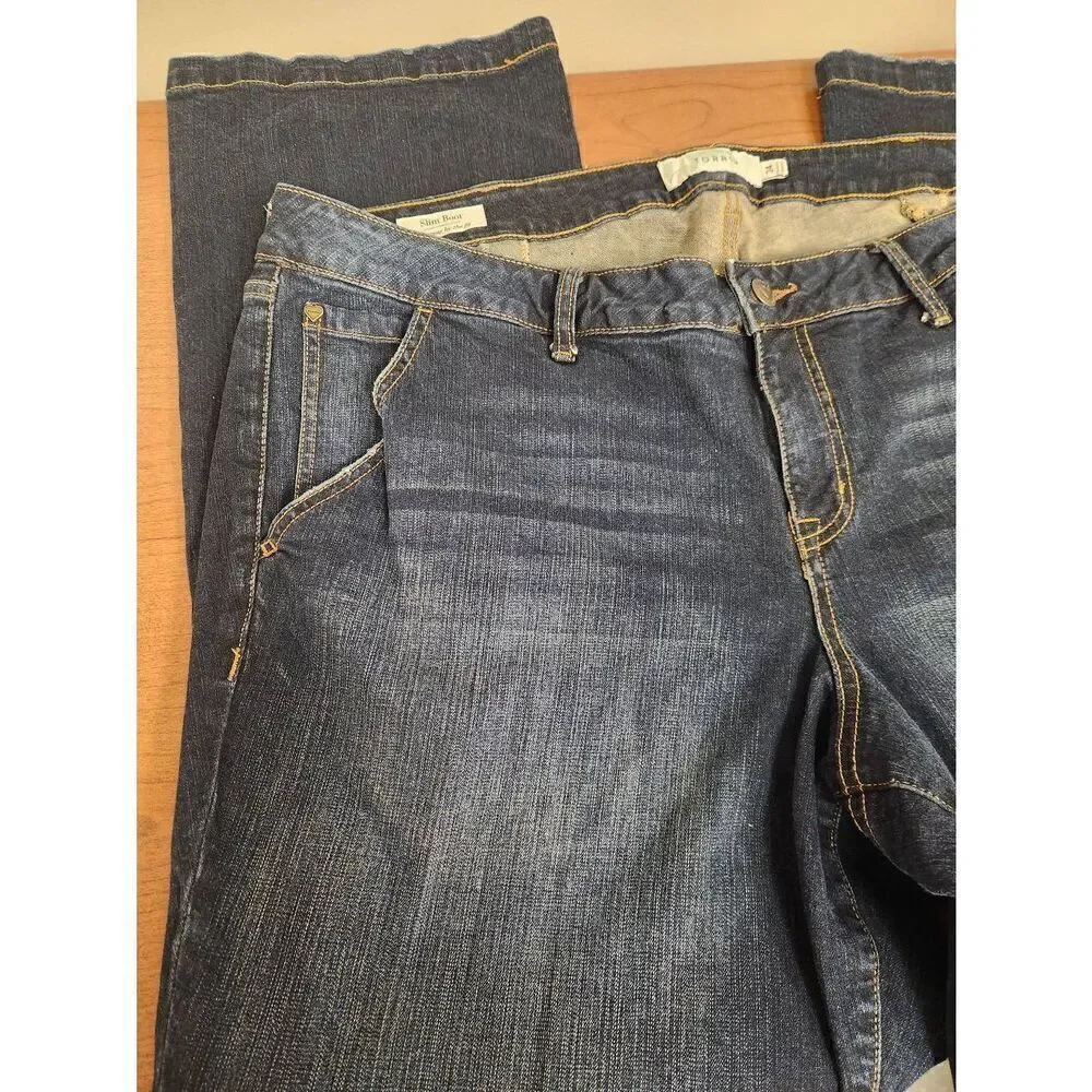 Torrid 24 slimming boot blue denim jeans. Measures approx 46 waist x 31 inseam x